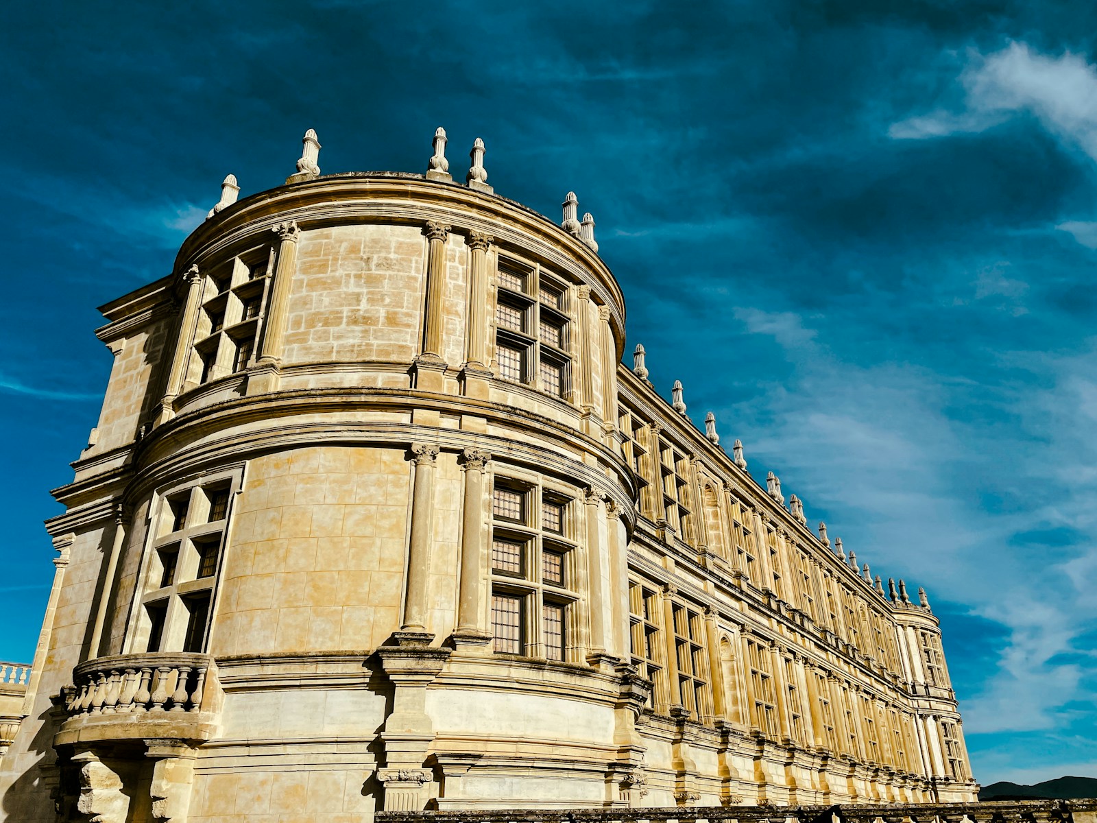 a large building with statues on top of it